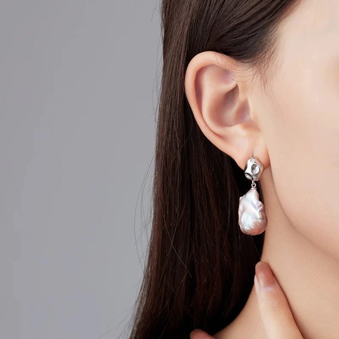 Baroque pearl irregular teardrop earrings with pink iridescent luster, S925 silver studs and star-set crystals. Unique organic drop jewelry for women