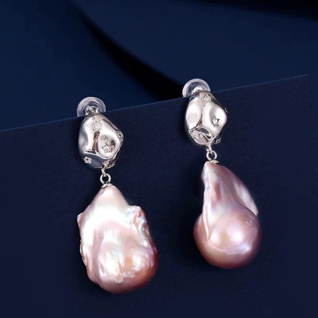aroque pearl irregular teardrop earrings with pink iridescent luster, S925 silver studs and star-set crystals. Unique organic drop jewelry for women