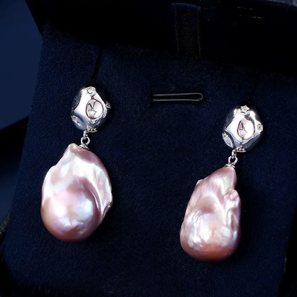 aroque pearl irregular teardrop earrings with pink iridescent luster, S925 silver studs and star-set crystals. Unique organic drop jewelry for women