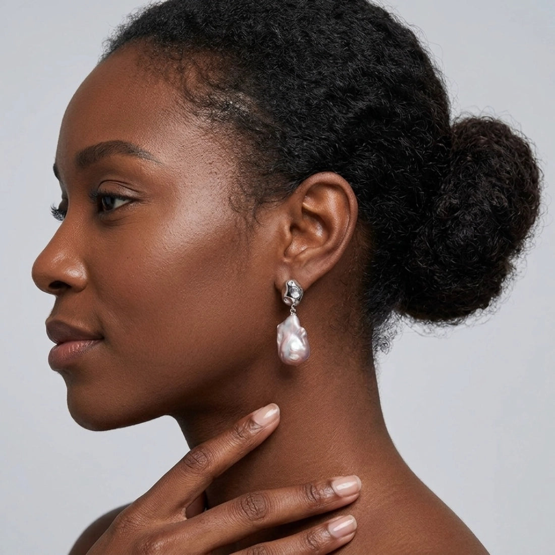 Baroque pearl irregular teardrop earrings with pink iridescent luster, S925 silver studs and star-set crystals. Unique organic drop jewelry for women