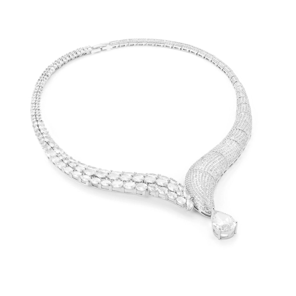 Crystal clear cubic zirconia jewelry set with silver-tone finish. Includes necklace, ring, earrings, and bracelet for weddings and formal wear