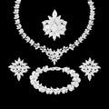 Crystal clear zircon jewelry set with silver-tone finish. Includes necklace, ring, earrings, and bracelet for weddings and formal wear
