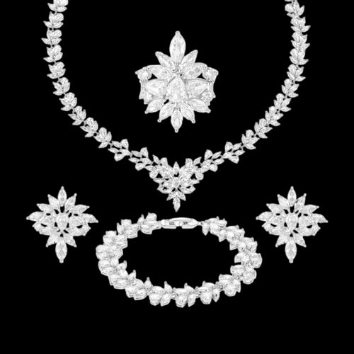 Crystal clear zircon jewelry set with silver-tone finish. Includes necklace, ring, earrings, and bracelet for weddings and formal wear