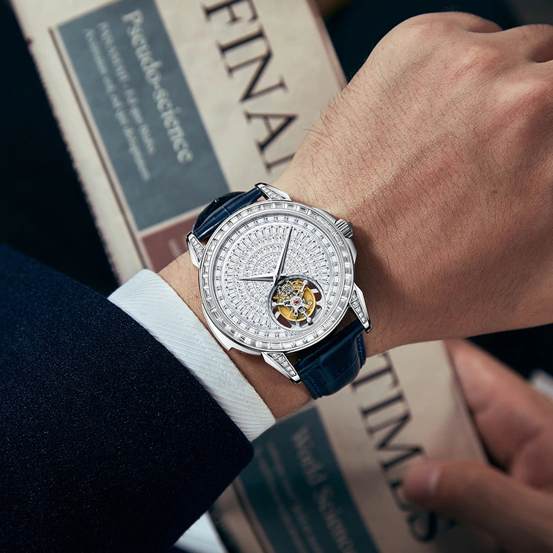 Men's luxury crystal tourbillon mechanical watch worn on wrist with suit cuff