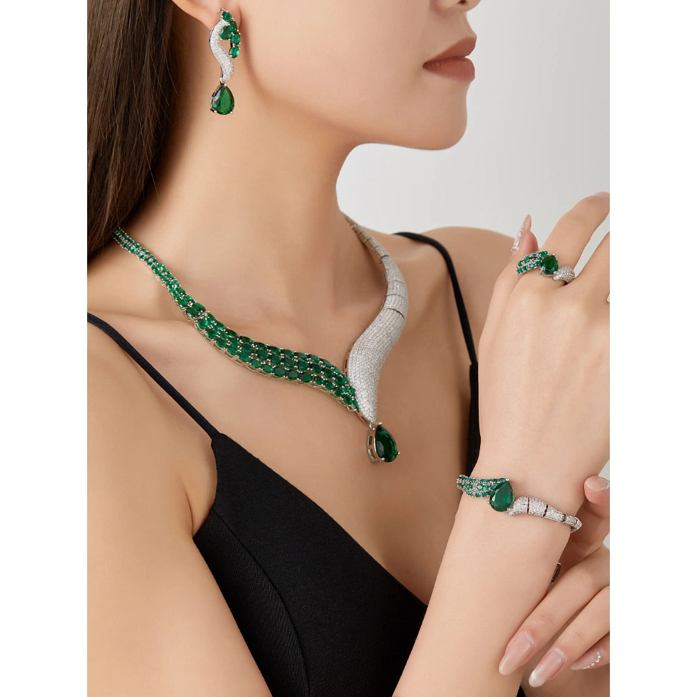 Emerald green zircon jewelry set with silver-plated copper. Includes necklace, ring, earrings, and bracelet for weddings and formal wear