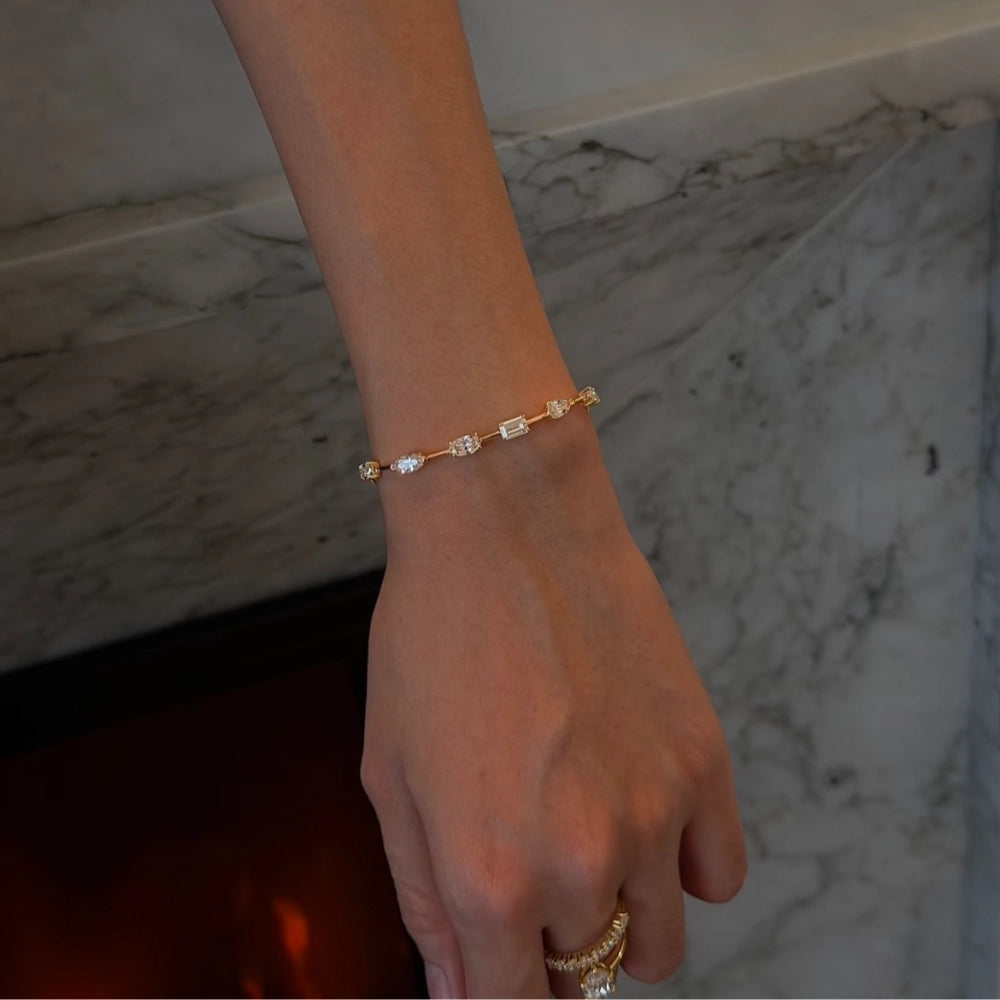 Close-up of fancy cut lab-grown diamond bracelet showing marquise, pear, and oval cut stones with brilliant sparkle