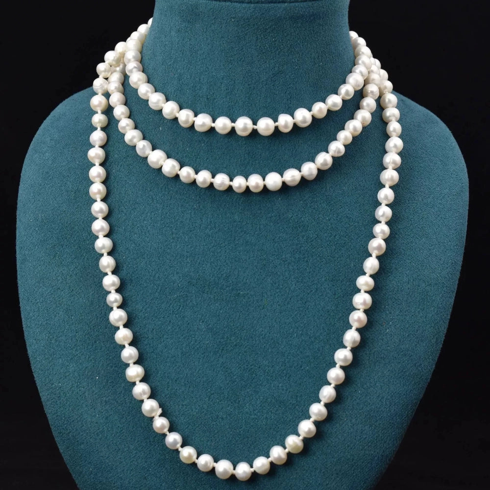 Close-up of 8-9mm natural freshwater pearls showing warm luster and near-round shape with natural surface variations
