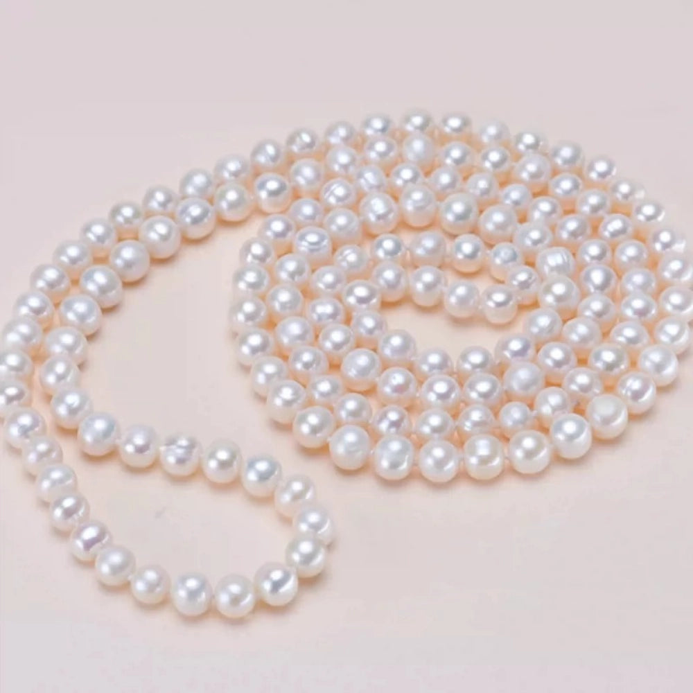 Long freshwater pearl necklace doubled up for a layered look, versatile 140-160cm sweater necklace styling
