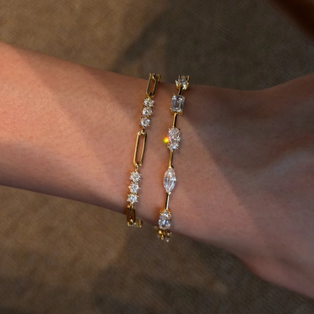 Woman wearing a 16cm lab-grown diamond fancy cut bracelet in gold-plated 925 silver, perfect for everyday luxury