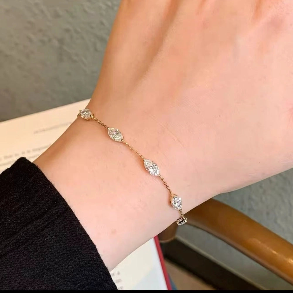 Lab-grown diamond fancy cut bracelet in 925 sterling silver with gold plating, featuring marquise, pear, oval and mixed cuts