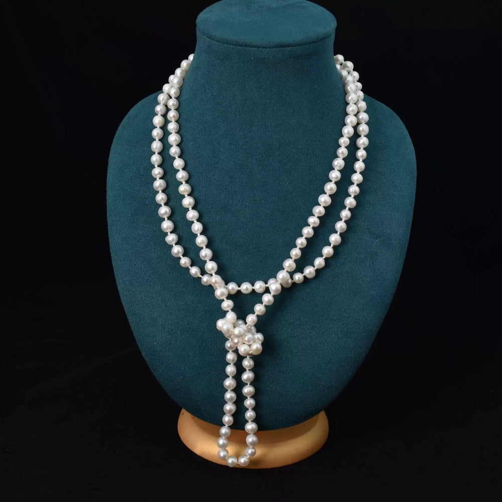 Woman wearing long freshwater pearl sweater necklace as a single strand, 140-160cm extra-long style for women
