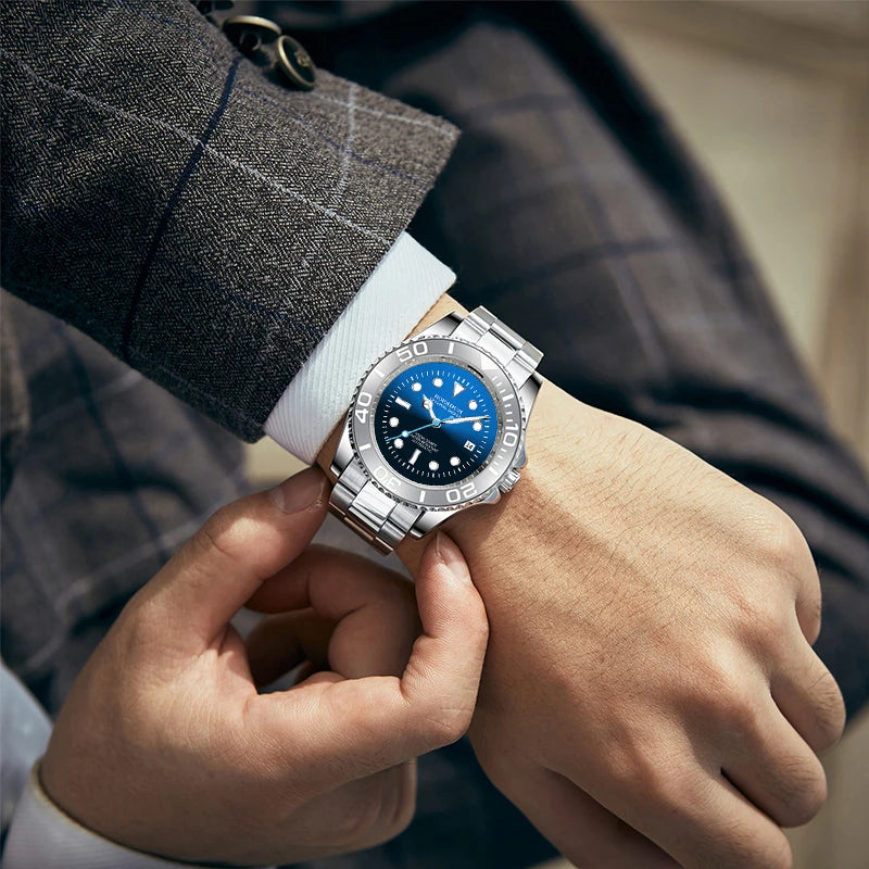 Close-up wrist shot of man wearing classic blue diver watch with plaid business jacket