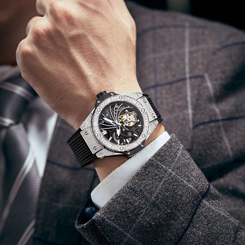 Close-up of man wearing luxury diamond skeleton watch on wrist with dark plaid suit jacket