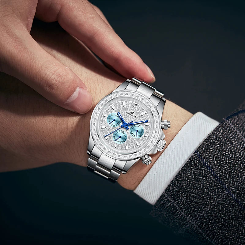 Close-up wrist shot of man wearing diamond pavé watch with suit jacket sleeve   