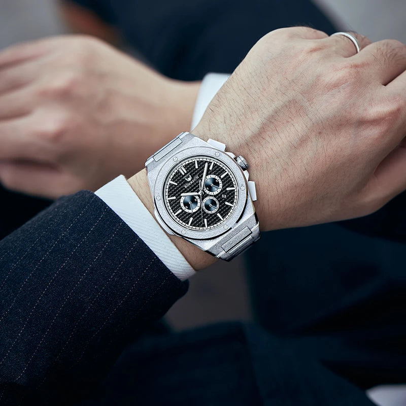 Man wearing frosted automatic watch paired with plaid coat and formal shirt