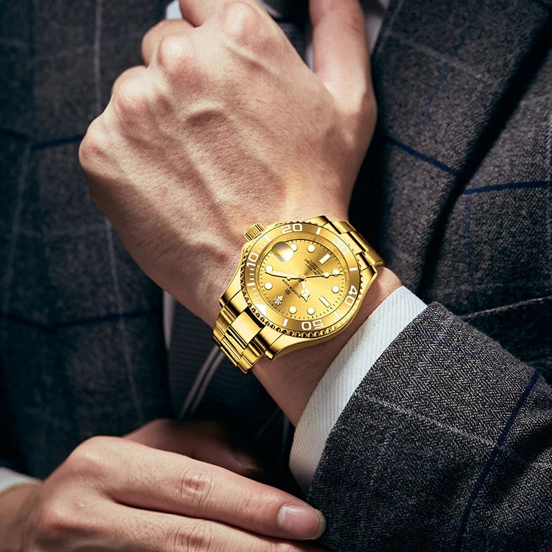 Wrist shot of a man wearing a 42mm gold automatic watch paired with a professional suit sleeve