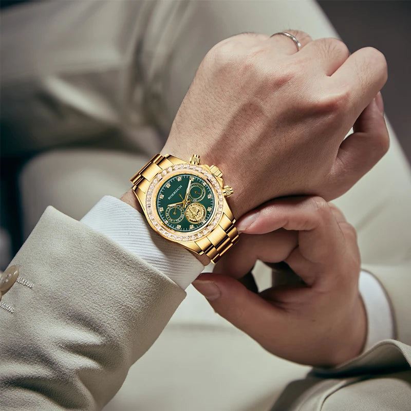 Close-up wrist shot of man wearing gold green dial dragon watch with light beige suit   