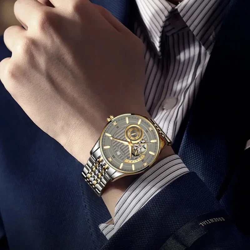 Close-up shot of the two-tone dress watch worn on wrist during a formal business meeting