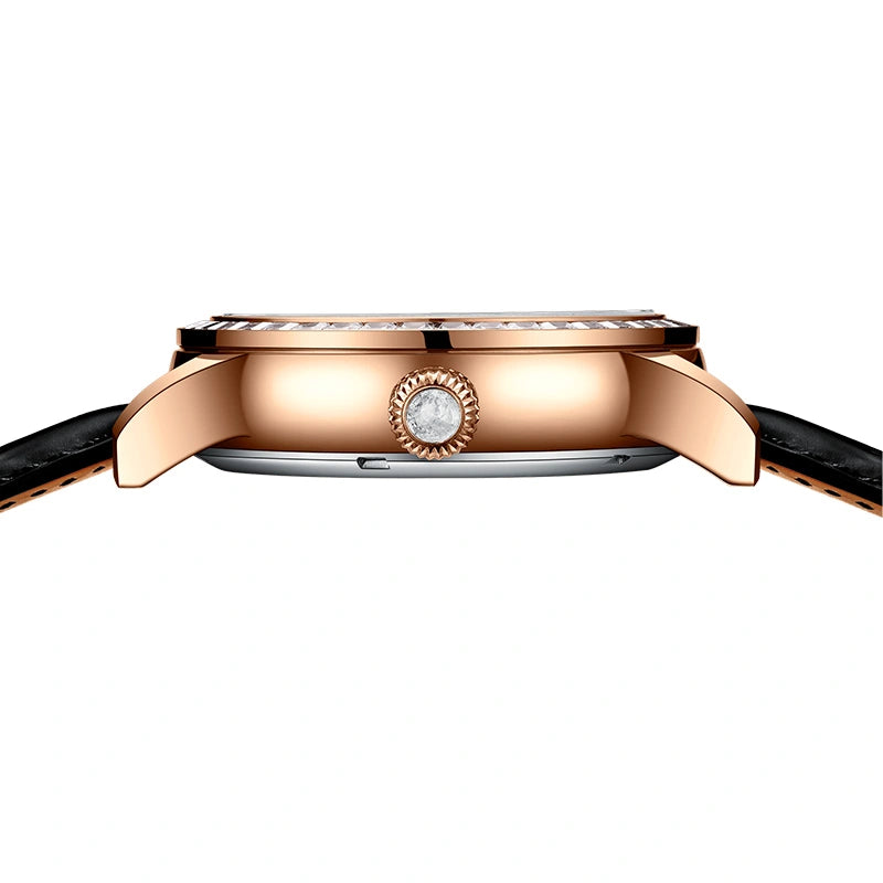 Close-up of the blue starry dial with textured hour markers and rose gold-tone hands