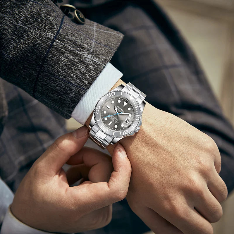 Close-up of a man wearing a 41mm stainless steel yacht style automatic watch with a plaid suit