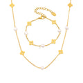 Model wearing a dainty 18K gold plated flower necklace and freshwater pearl bracelet set