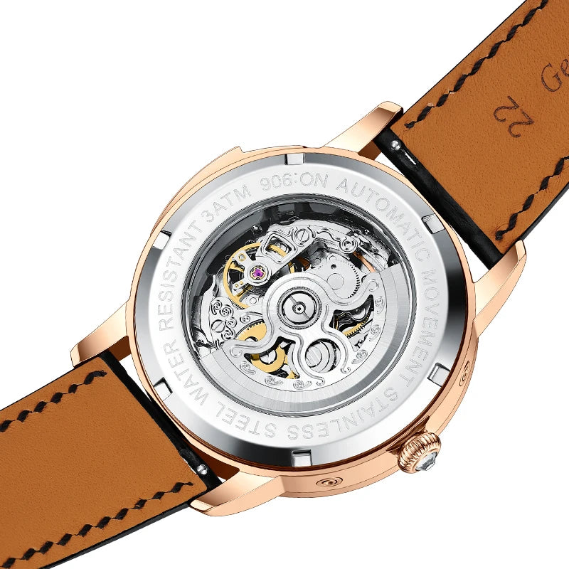Transparent exhibition case back revealing automatic self-winding movement and brown leather strap lining