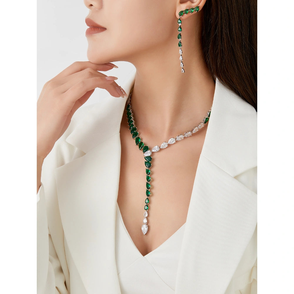 Sapphire blue and emerald green cubic zirconia jewelry set with silver-tone finish. Includes Y-necklace and dangle earrings for weddings and formal wear