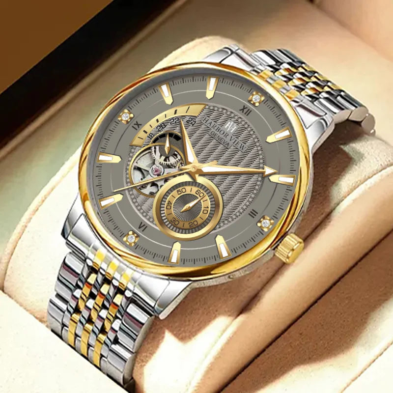 Luxury two-tone mechanical watch presented on a cream leather cushion inside a box