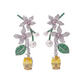 Vintage floral yellow cubic zirconia and pearl drop earrings with silver-plated copper. Sparkling dangle earrings for weddings and formal occasions