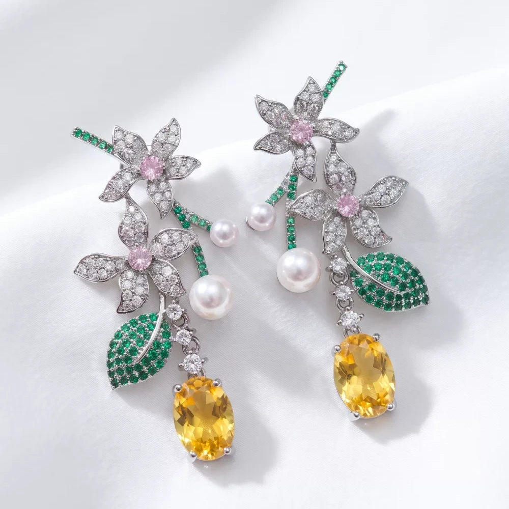 Vintage floral yellow cubic zirconia and pearl drop earrings with silver-plated copper. Sparkling dangle earrings for weddings and formal occasions