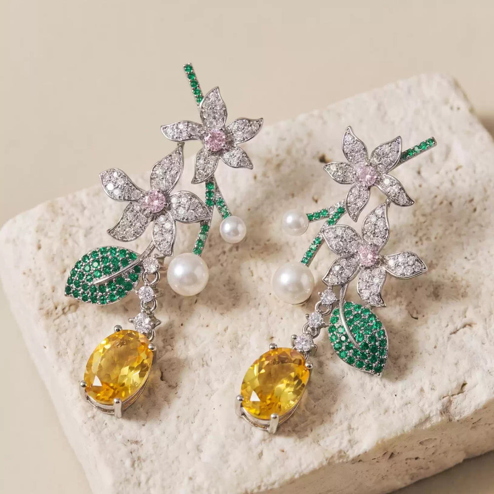 Vintage floral yellow cubic zirconia and pearl drop earrings with silver-plated copper. Sparkling dangle earrings for weddings and formal occasions