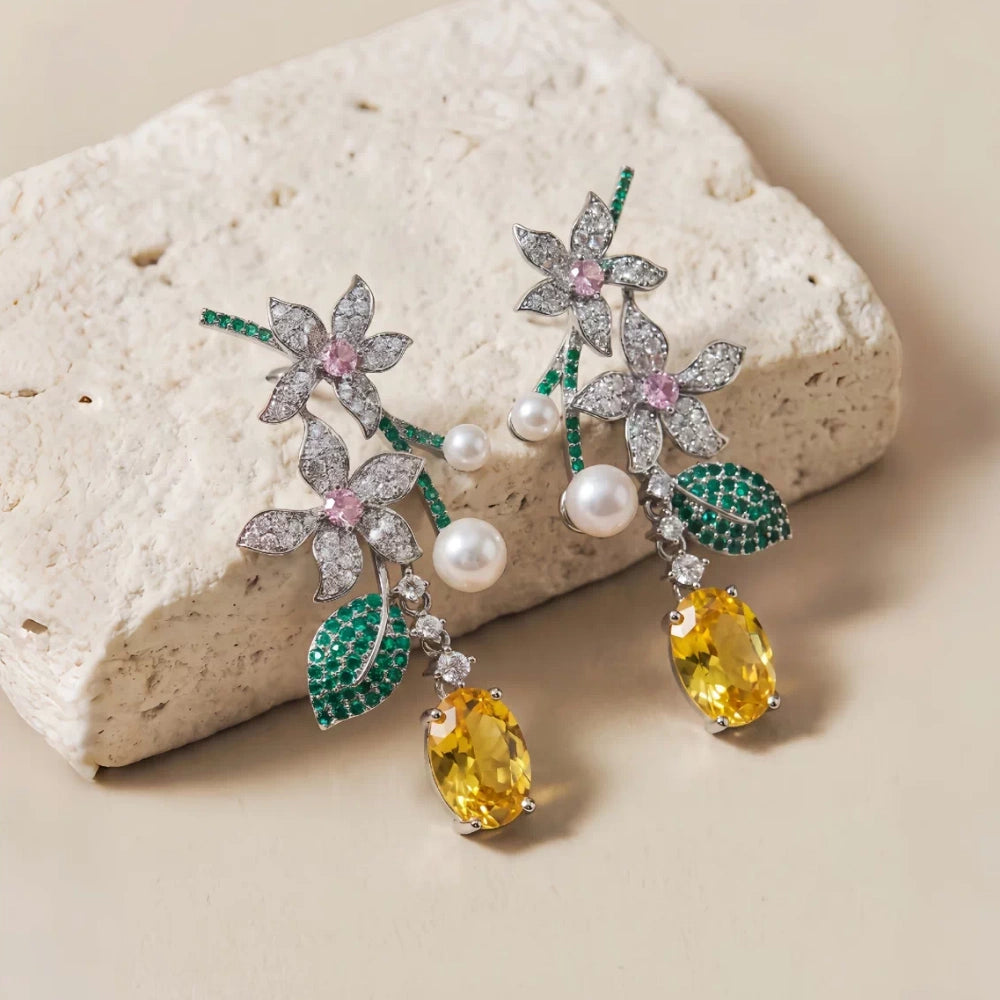 Vintage floral yellow cubic zirconia and pearl drop earrings with silver-plated copper. Sparkling dangle earrings for weddings and formal occasions
