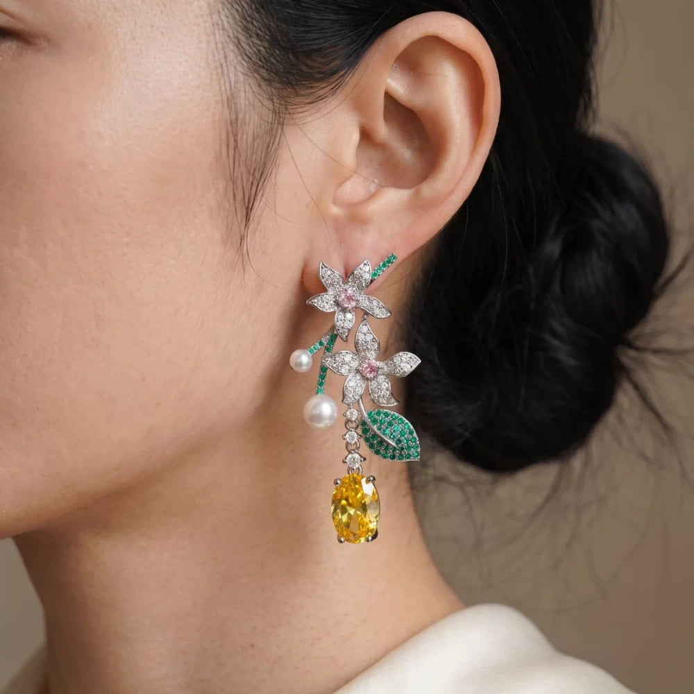 Vintage floral yellow cubic zirconia and pearl drop earrings with silver-plated copper. Sparkling dangle earrings for weddings and formal occasions