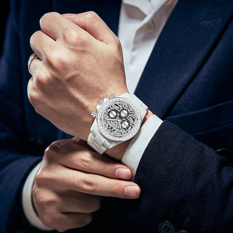 Man wearing 39.5mm white ceramic diamond watch with navy blue suit jacket
